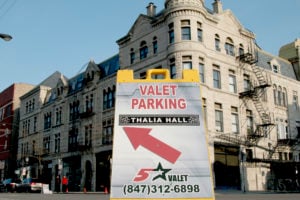 A valet parking sign from Five Star Valet points to the location of a stand near Thalia Hall.